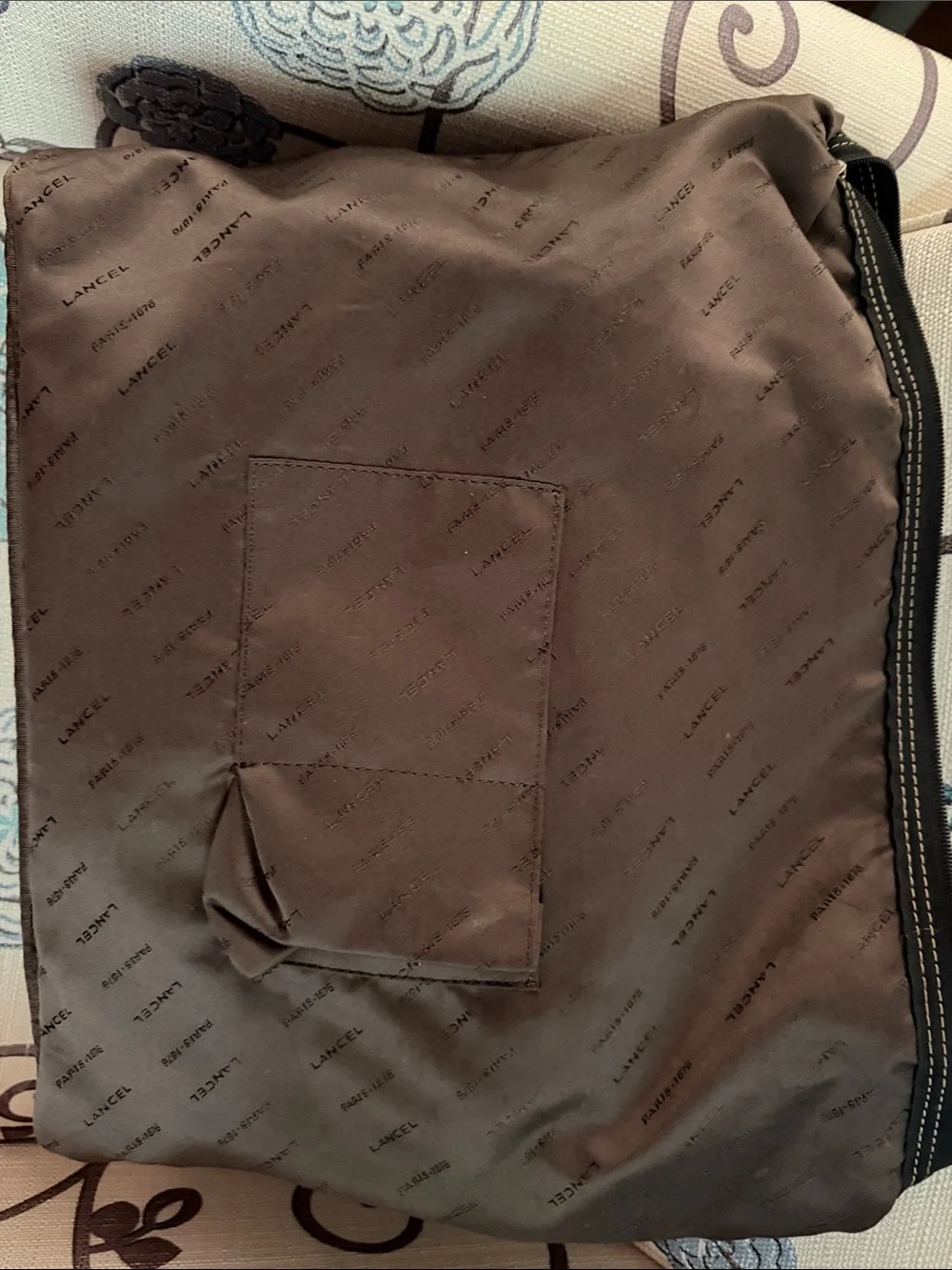 Black Duffel Bag with Tan Handles and Brown Accents